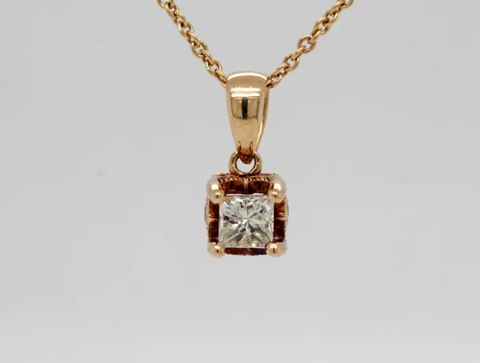 FULLERS PURCHASE FROM PUBLIC Necklaces Estate 10KY .28 Ct Princess Cut Diamond and .04 Cttw Ruby Pendant